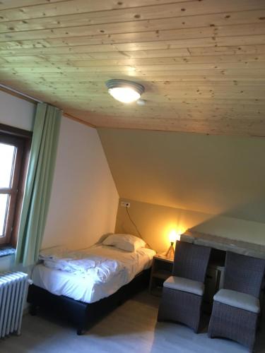 Giường trong phòng chung tại Te Lande