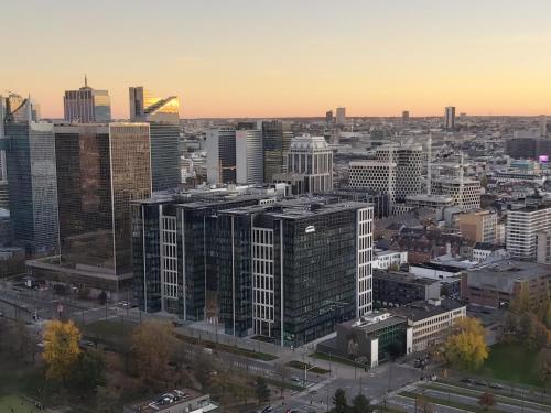 an aerial view of a city with tall buildings at Romantic room in brussels sky in Brussels