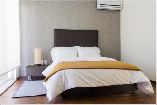 Katil atau katil-katil dalam bilik di Redwood Villas Zona Industrial San Luis Potosi
