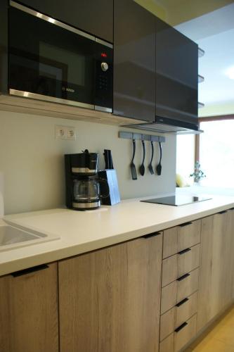 a kitchen with a counter top with a coffee maker at Apartmány Kvetná in Rajecké Teplice