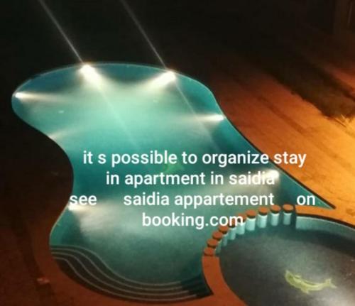 an image of a guitar with the words it is possible to organize stay in appointment at Hotel LAHLOU riad Cafeteria in Oujda