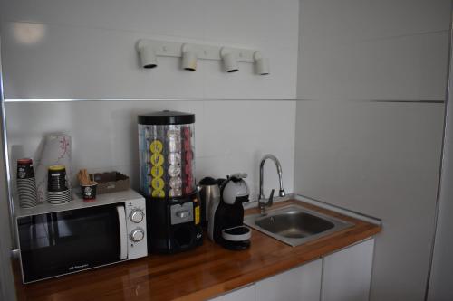 Kuchyň nebo kuchyňský kout v ubytování Hostal Lucy