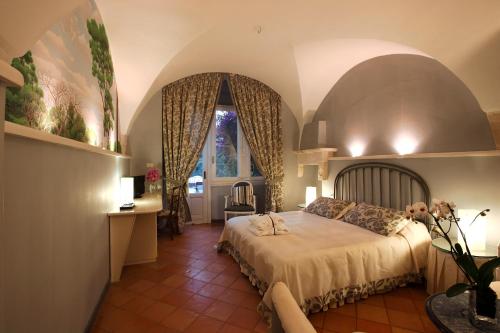 เตียงในห้องที่ Hotel Park Novecento Resort