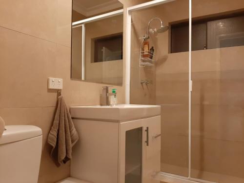 a bathroom with a sink and a shower at Lake Estate Stay in Perth