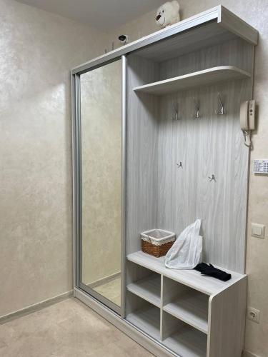 a shower in a bathroom with a glass door at апартаменти люкс роксолани 16 in Truskavets
