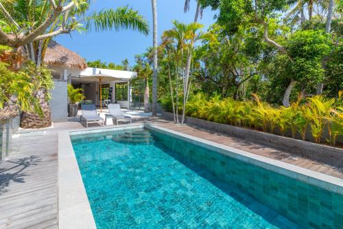 a swimming pool in the backyard of a villa at Villa Lempuyangdream in Karangasem