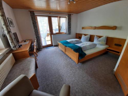 מיטה או מיטות בחדר ב-Gasthaus Ratsstüble Garni