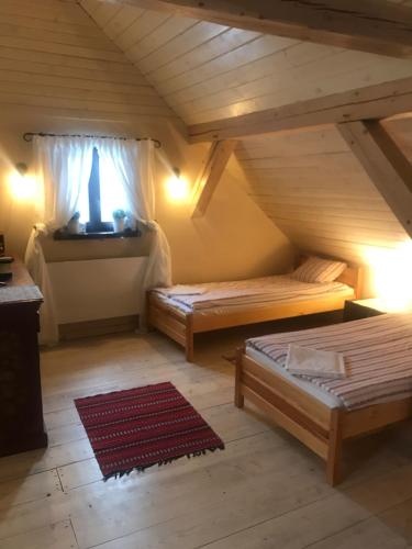 Ліжко або ліжка в номері Siedlisko Błominko