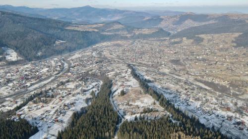 an aerial view of a city in the mountains at Chalet PidStromom in Mykulychyn