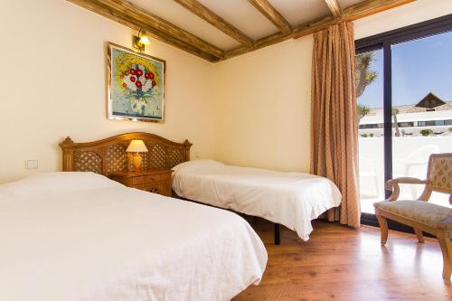 Llit o llits en una habitació de Sands Beach Active Resort
