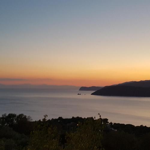 a view of the ocean at sunset at Rosa dei Venti Est in Capoliveri