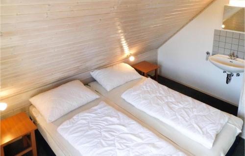 a bed and a sink in a small room at Ferienhaus 15 In Kirchheim in Kirchheim
