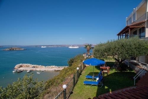 a balcony with a view of the water at Villa Dina Apartments in Almyrida