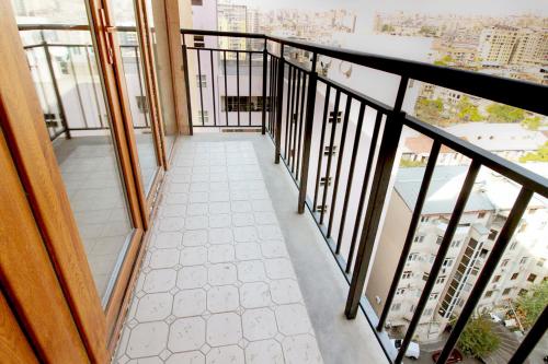 a balcony with a view of a city at Apartments in Alley Residence in Yerevan