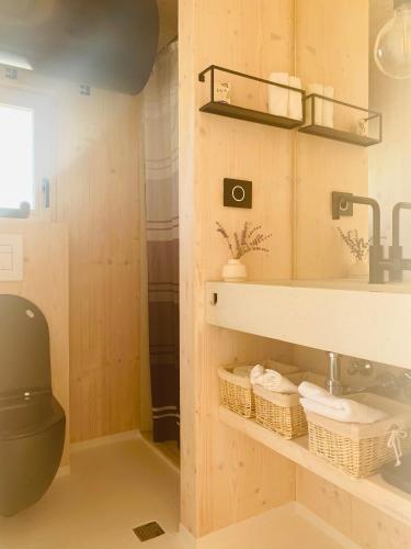 a bathroom with a toilet and a sink at Ecobeachvilla Buqez 9 in Pakoštane