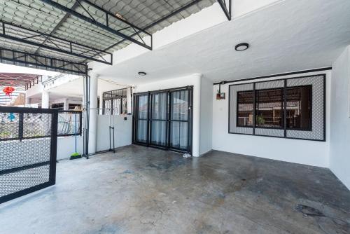 an empty room with windows and a fence at 3BR Family-Friendly Landed House,PandanPerdana,KL by Verano in Kuala Lumpur