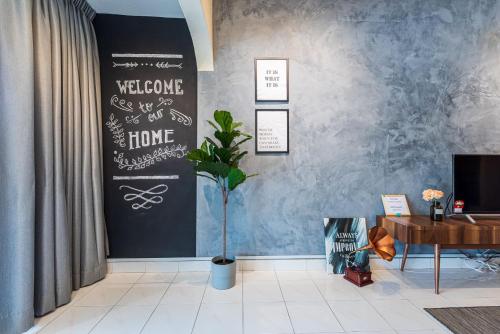 a room with a black wall with a potted plant at 3BR Family-Friendly Landed House,PandanPerdana,KL by Verano in Kuala Lumpur