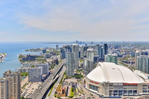 an aerial view of a city with a large building at Two BD CN Tower and Lake Ontario View in Toronto