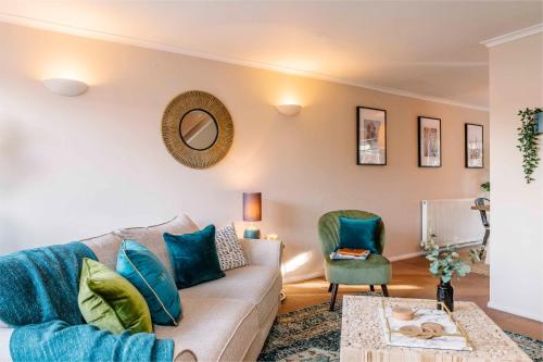 a living room with a couch and a chair at Castle Gate by Spa Town Property - Central Location with Large Living Space in Warwick