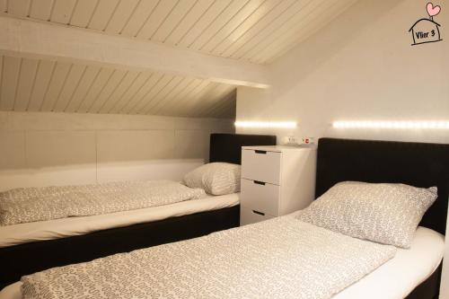 Llit o llits en una habitació de De Vlier - Vakantiewoningen