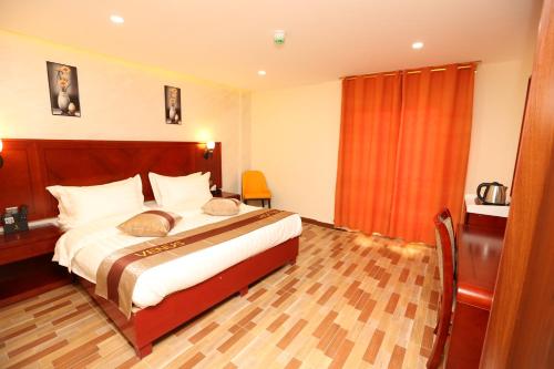 Postel nebo postele na pokoji v ubytování Venus Hotel