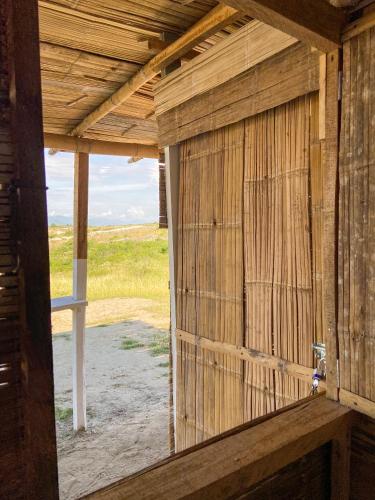 an inside view of a wooden building with a window at biohotel tatacoa Qji in Villavieja