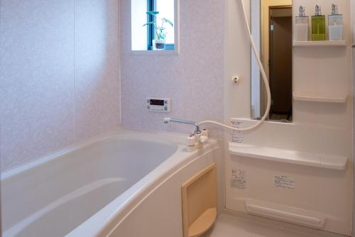 Een badkamer bij Garden Nikko Guest House