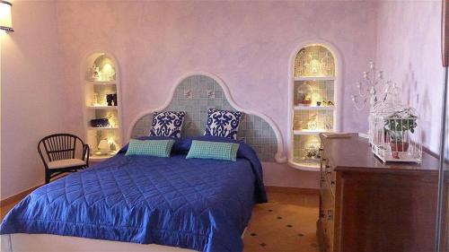 Ένα ή περισσότερα κρεβάτια σε δωμάτιο στο Casa Pirrera Asinelli