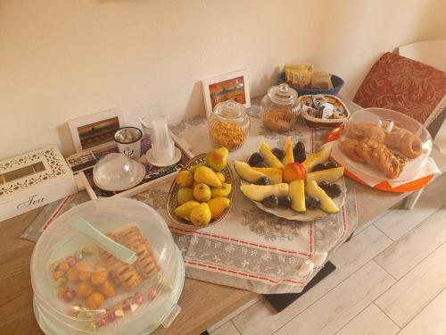 a table with many different types of food on it at Sos Manneddos in Posada