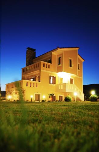 a large house at night with the lights on at Elaia Villas in Pythagoreio