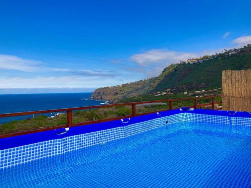 a swimming pool with a view of the ocean at Casa Vistazul in La Orotava