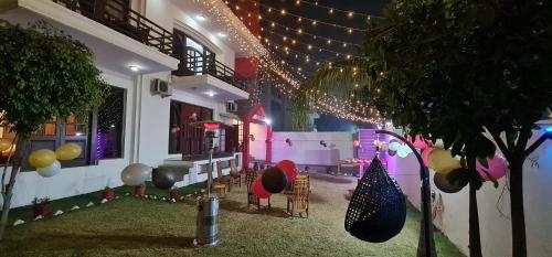a room with a building with lights and balloons at Nook Inn & Suites - MG ROAD METRO in Gurgaon