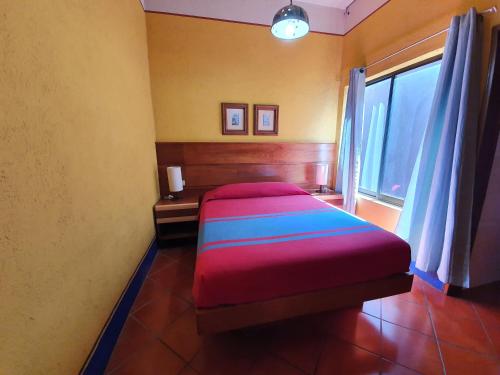 Vuode tai vuoteita majoituspaikassa Hotel Suites Del Centro
