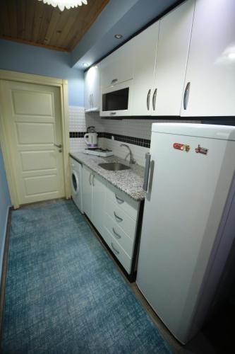 Kuchyň nebo kuchyňský kout v ubytování Bella Suit Apart Hotel
