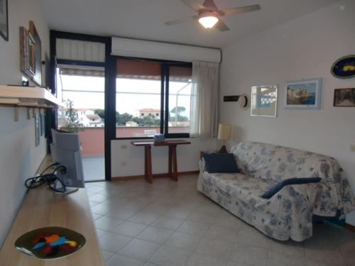 a living room with a couch and a table at Ammiraglio in Campese