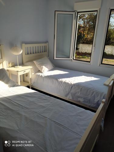 Un ou plusieurs lits dans un hébergement de l'établissement casa indiana en A Guarda