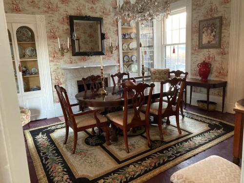 a dining room with a table and chairs at The Federal House in Galena