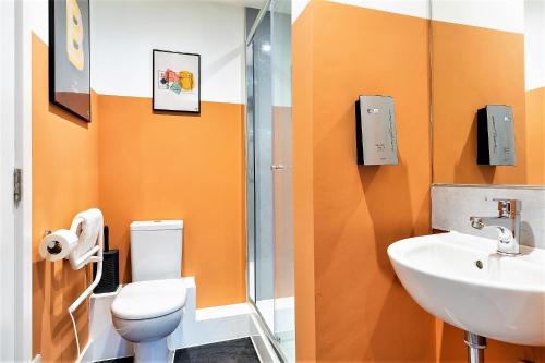 a bathroom with a toilet and a sink at Your Apartment I Clifton Village in Bristol