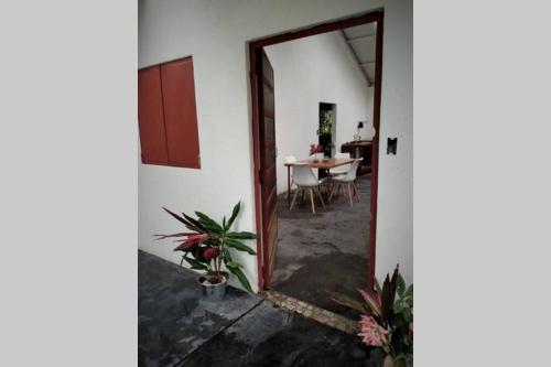 an open door to a dining room with a table at Casa Bolita in Dos Brazos