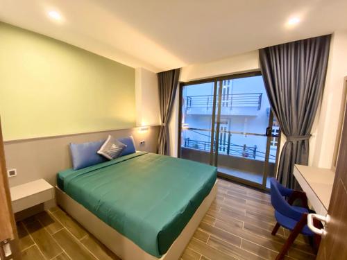 Giường trong phòng chung tại Kim Oanh Apartment
