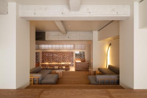 a rendering of a room with couches and a table at cup of tea ensemble in Takayama