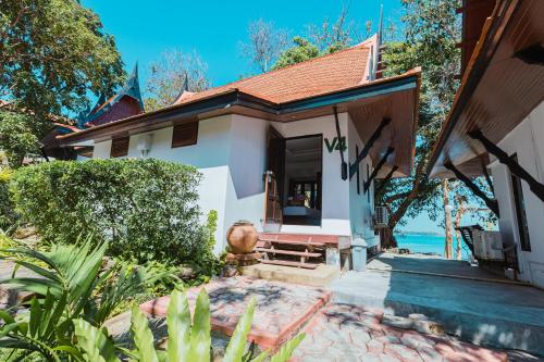 a home with a pathway leading to the front door at Vimarn Samed Resort in Ko Samed