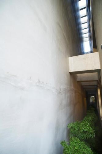 a hallway in a building with green plants at FFF Hotel in Hengchun