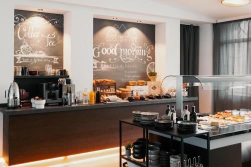 a bakery with a counter with food on it at Hotel Esplanade in Gmunden
