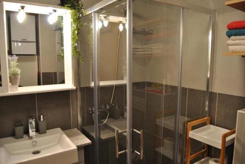 a bathroom with a shower and a sink at Apartman Nai in Bjelašnica