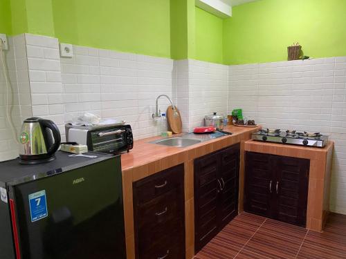 Kuchyň nebo kuchyňský kout v ubytování Villa Melanting