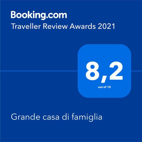 a screenshot of a cell phone with the text travel review awards at Grande casa di famiglia in Temù