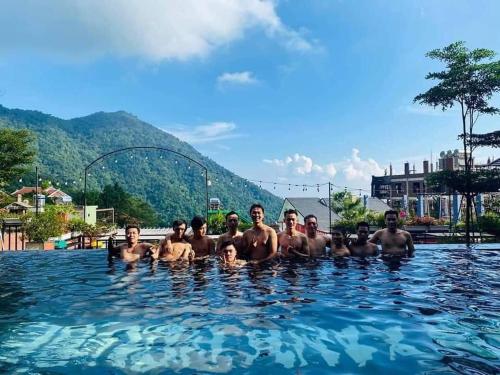 a group of men in a swimming pool at Bách Xanh House. Nhà Đa Giác in Vĩnh Phúc