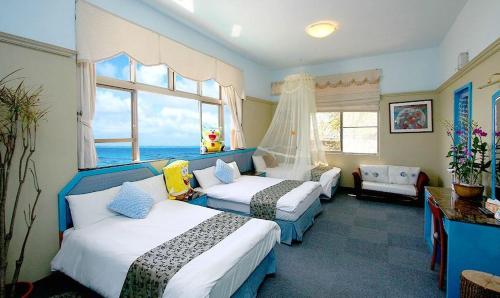 Ένα ή περισσότερα κρεβάτια σε δωμάτιο στο Sunny Ocean B&B