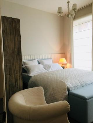 En eller flere senge i et værelse på Kirisavan Bed&Breakfast